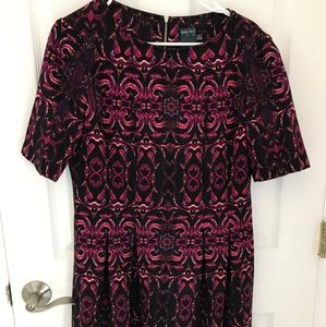 Dress with hues of pinks, reds and black